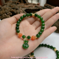 vòng tay ngọc bích mix túi tiền và charm nam hồng